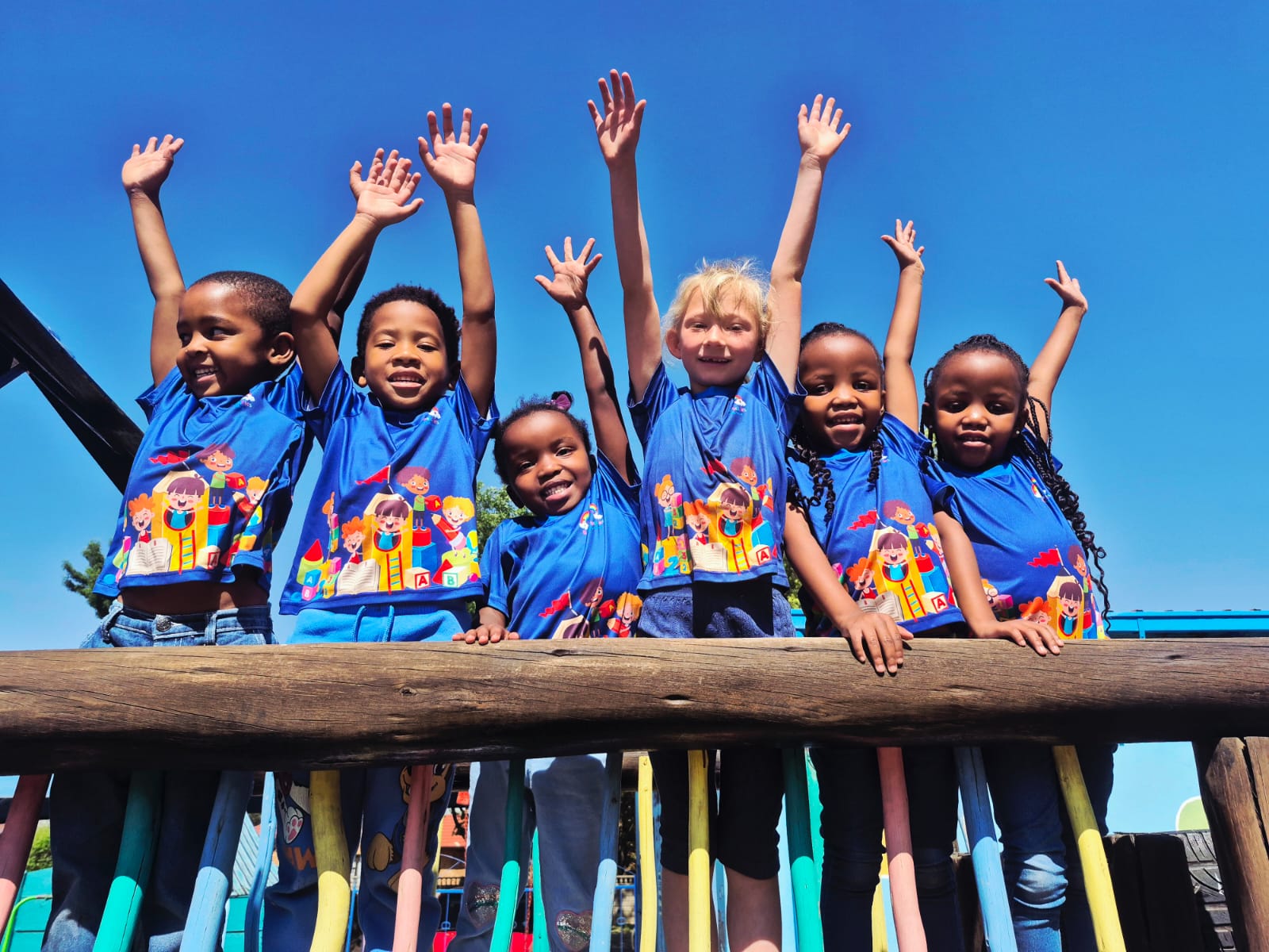 Children smiling together outside